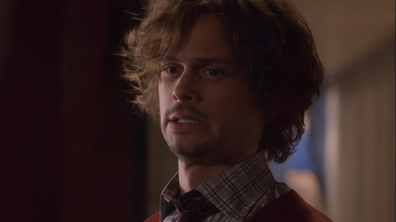 Spencer Reid grimacing