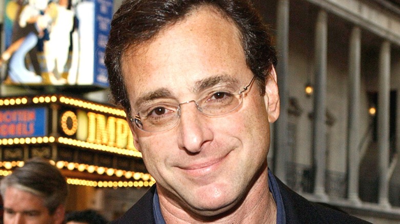 Bob Saget in front of marquee