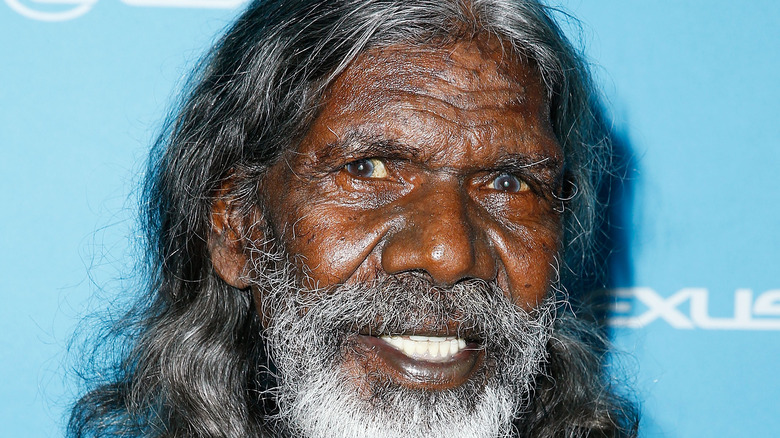 David Gulpilil smiling for photogs