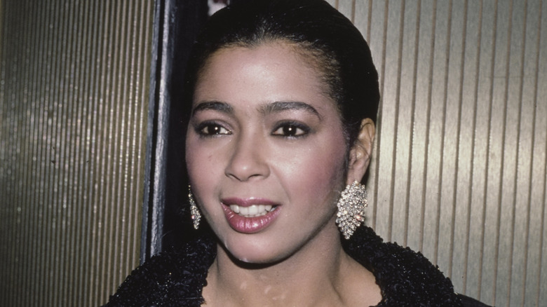 Irene Cara wearing diamond-like earrings 