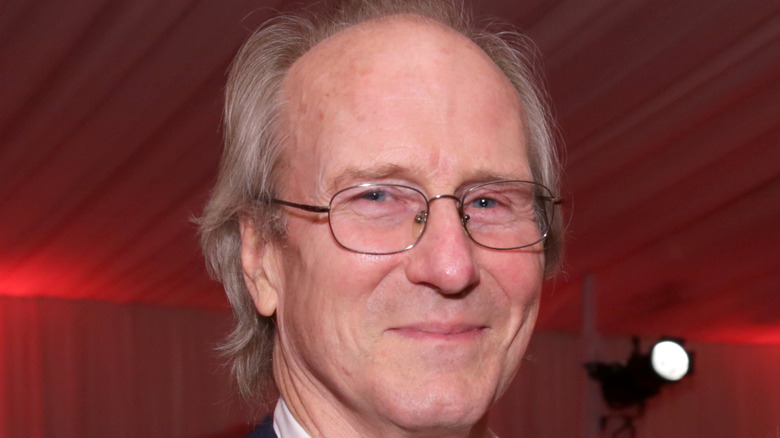 William Hurt wearing glasses