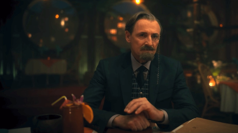 Reginald Hargreeves sat at the table with files