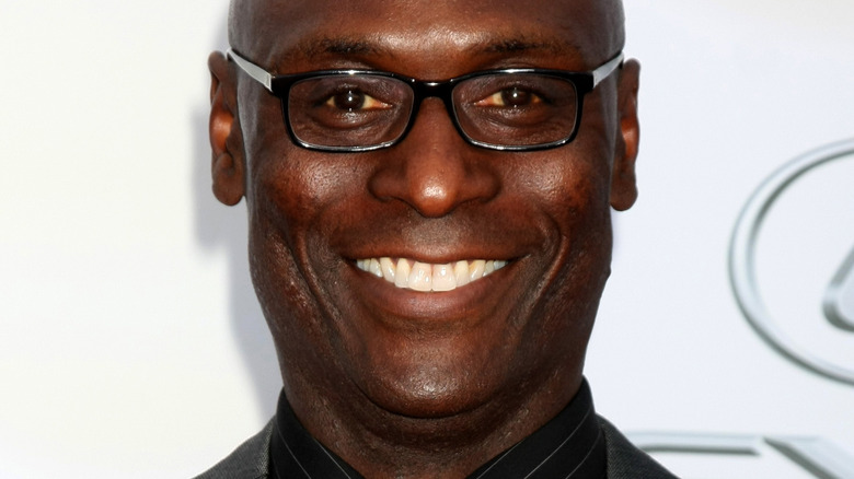 Lance Reddick smiles