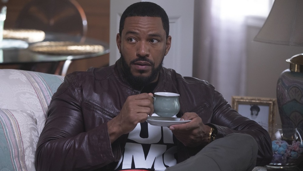 Laz Alonso drinking tea