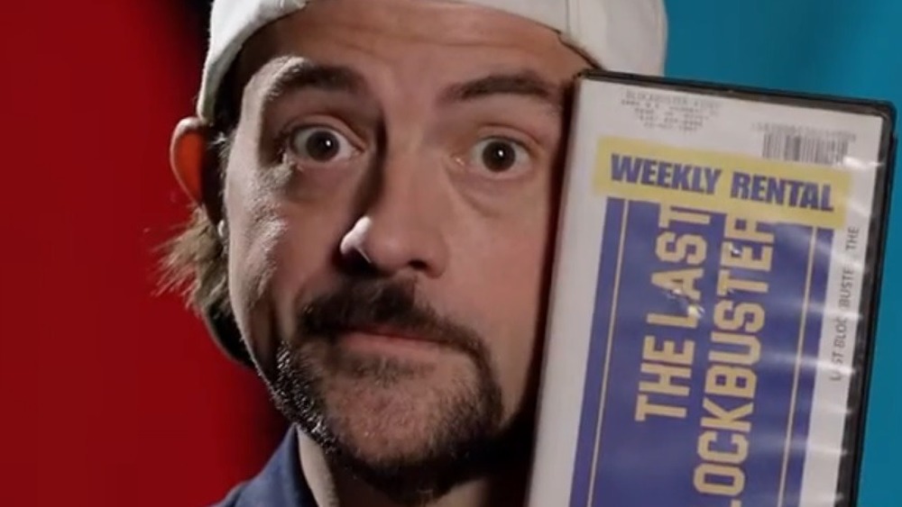 Kevin Smith holding blockbuster tape