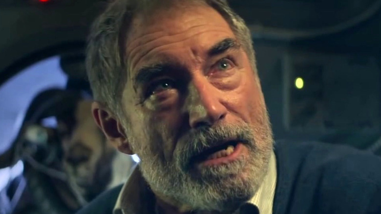 Dr. Niles Caulder staring offscreen