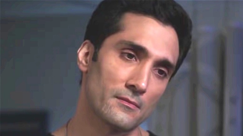Dominic Rains with head tilted 
