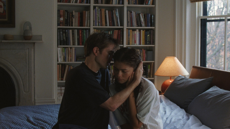 Charlie embraces Emma sitting on their bed in "The Drama" (2026)