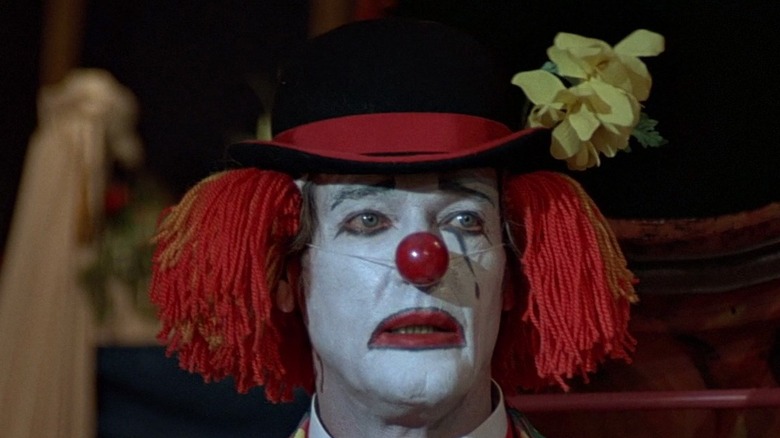 Roger Moore as James Bond in clown makeup in "Octopussy"