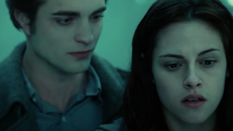 Edward looks at Bella from behind