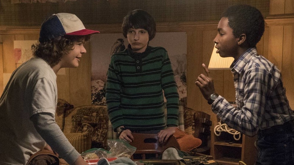 The central cast of characters play Dungeons & Dragons on Stranger Things