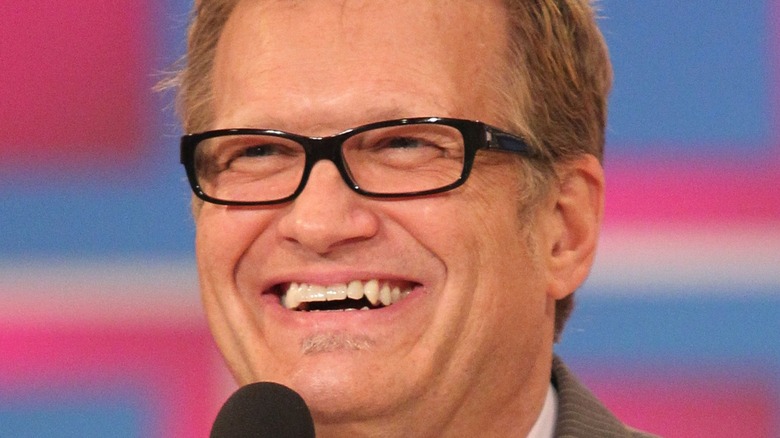 Drew Carey laughing while hosting