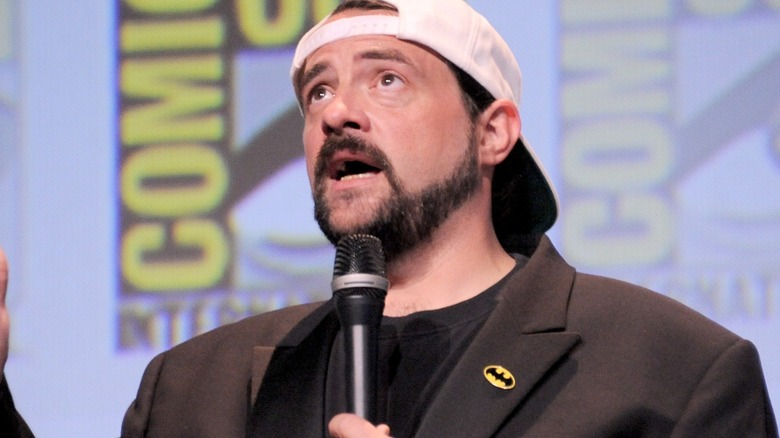 Kevin Smith holding microphone 