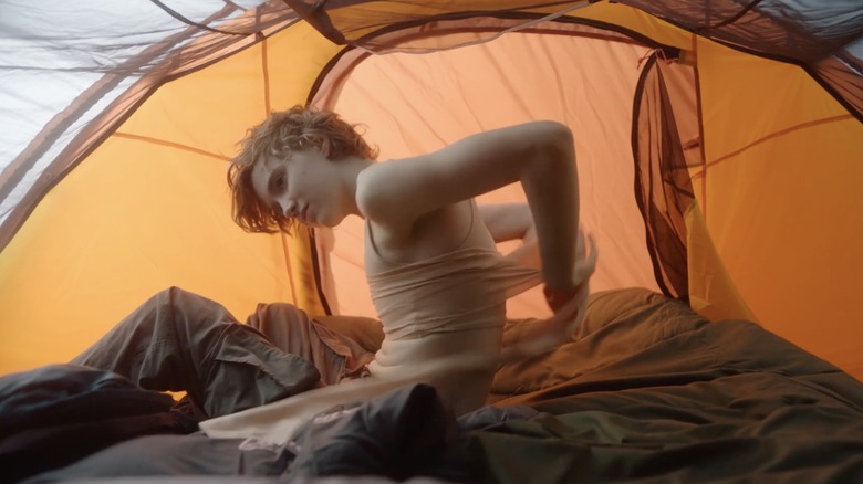 Person in tent The End