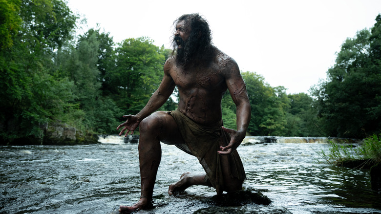 Samson kneeling in a river in "28 Years Later: The Bone Temple" (2026)