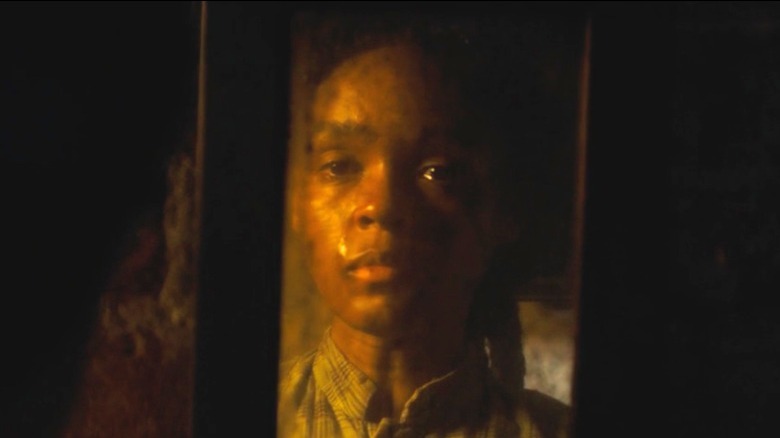 Veronica looking at her reflection in the mirror