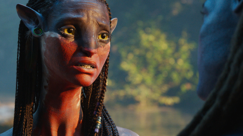Neytiri in face paint talking to Jake in Avatar: Fire and Ash