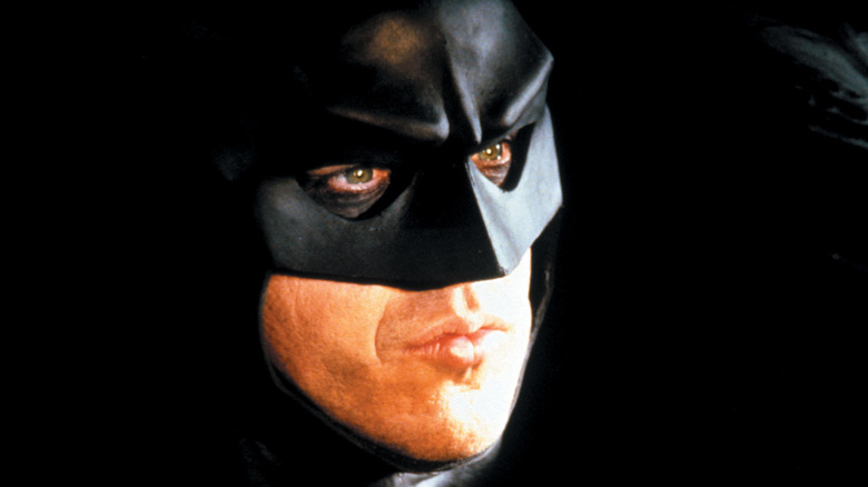 Batman drives the Batmobile