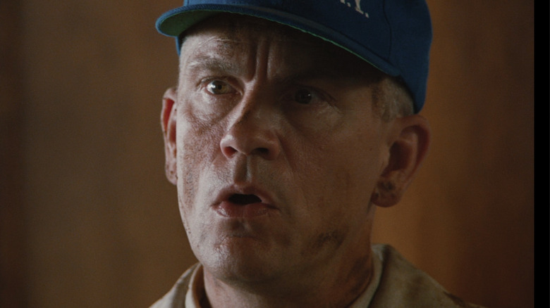 John Malkovich scowling