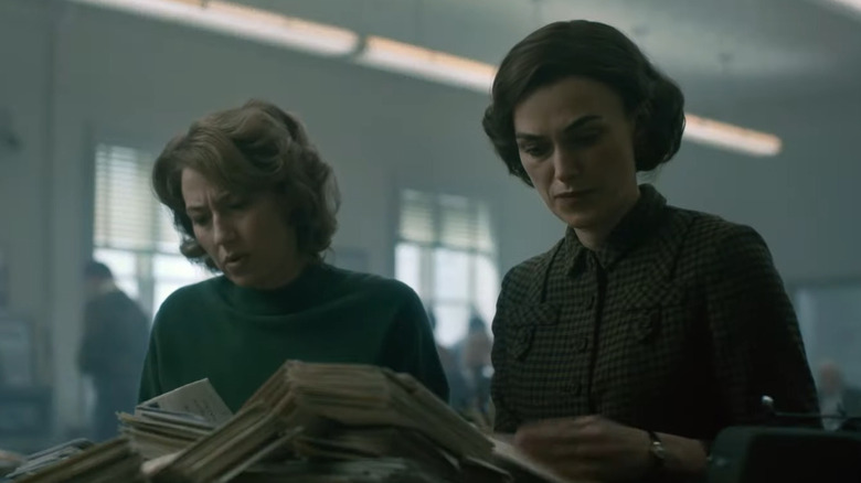 Jean and Loretta looking through mail