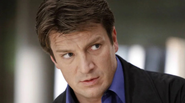Richard Castle looking upset while talking