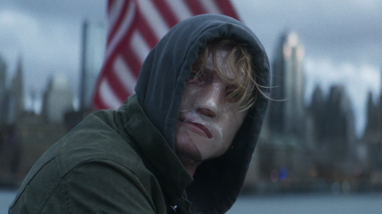 A scarred Matt Hagen looking around on a Gotham boat in "Clayface" (2026)