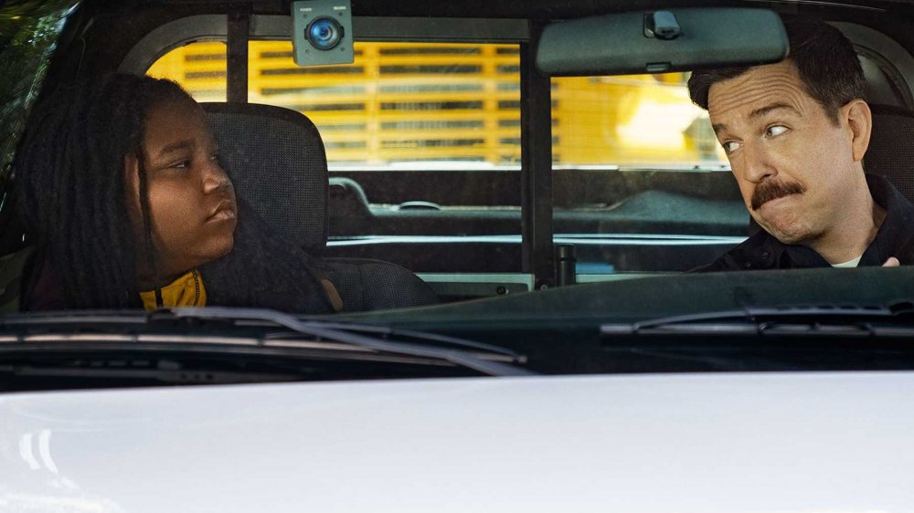 Terence Little Gardenhigh as Kareem and Ed Helms as Officer James Coffee in Coffee & Kareem