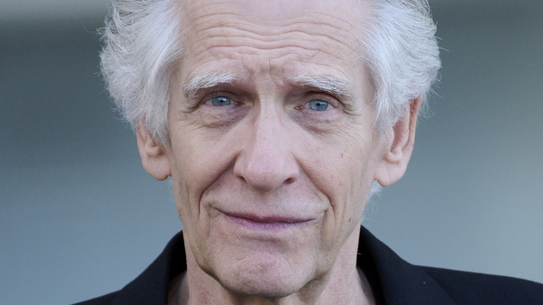 David Cronenberg half smile looks at camera