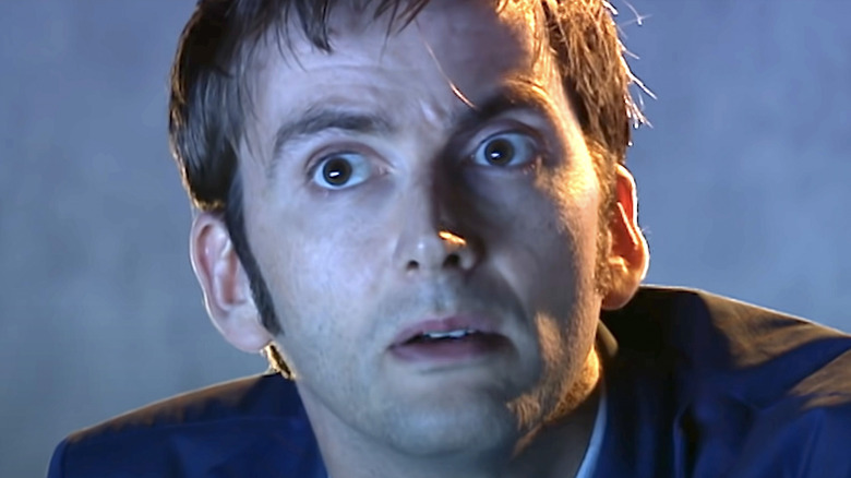 The Doctor frowning into space