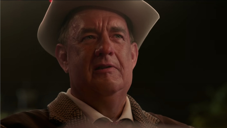 Colonel Tom Parker looks skeptical in close-up