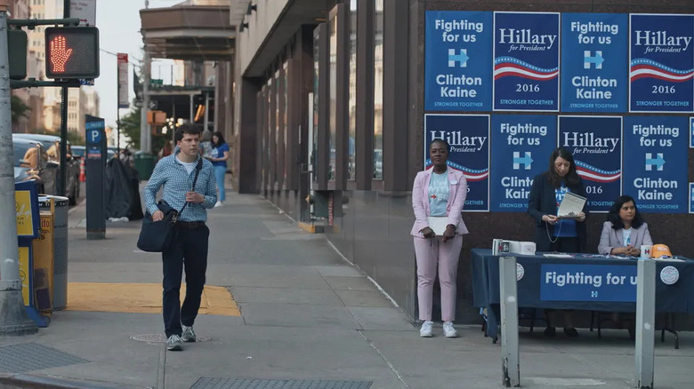 Toby walks past a campaign table