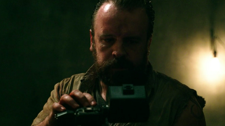 Alan watching footage of journey