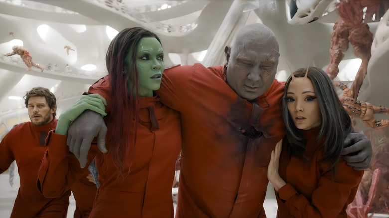 Gamora and Mantis carry Drax