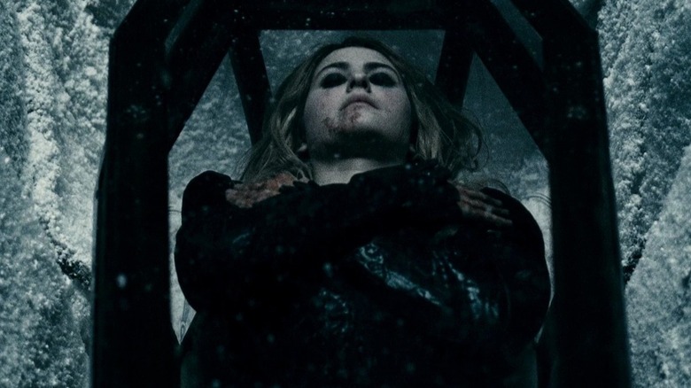Laurie lying in coffin