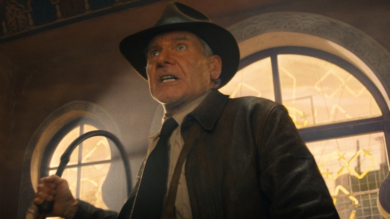 Indiana Jones holds his whip