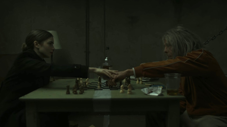 Lily Collins and Simon Pegg play chess