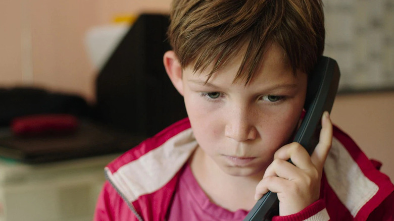 Jack makes a phone call in "Jack" (2014)