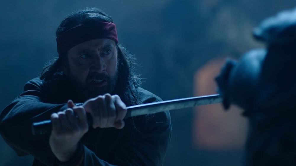 Wylie fighting alien with sword