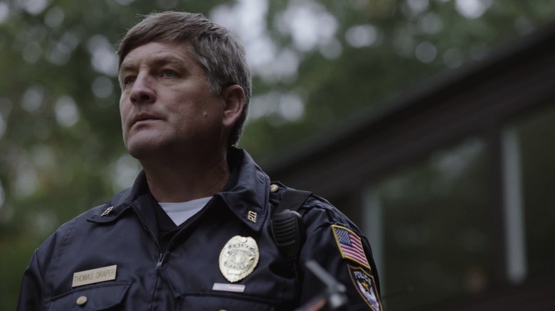 Police officer looking around
