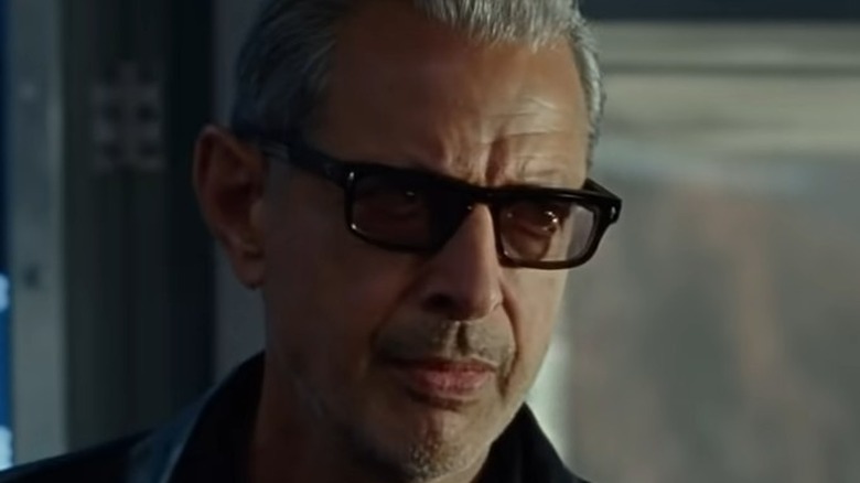 Ian Malcolm wearing glasses