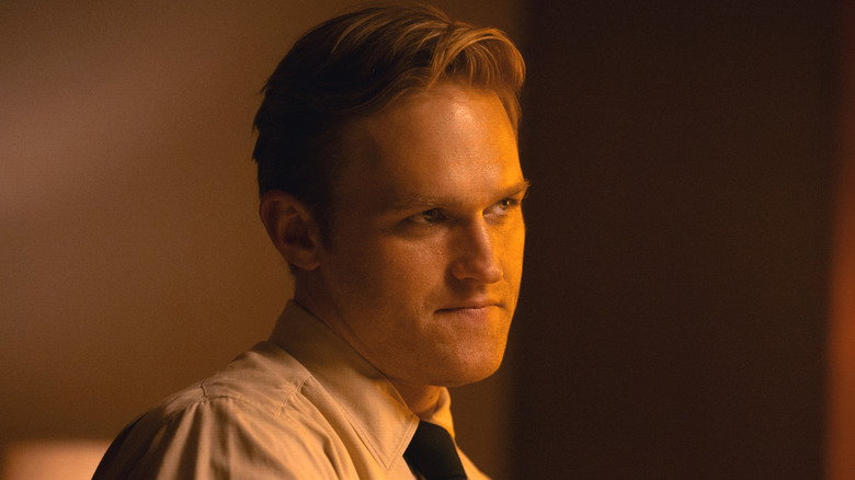 Lee Shaw wearing a shirt and tie in Monarch: Legacy of Monsters