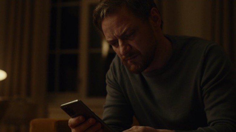 James McAvoy crying and looking at cell phone