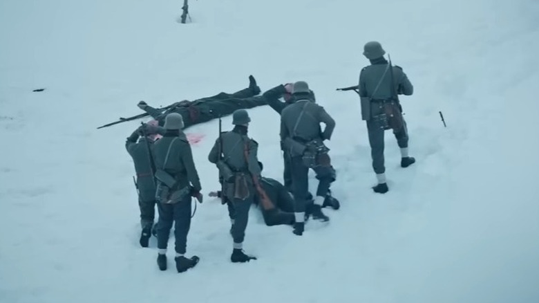 German soldiers holding prisoners at gunpoint