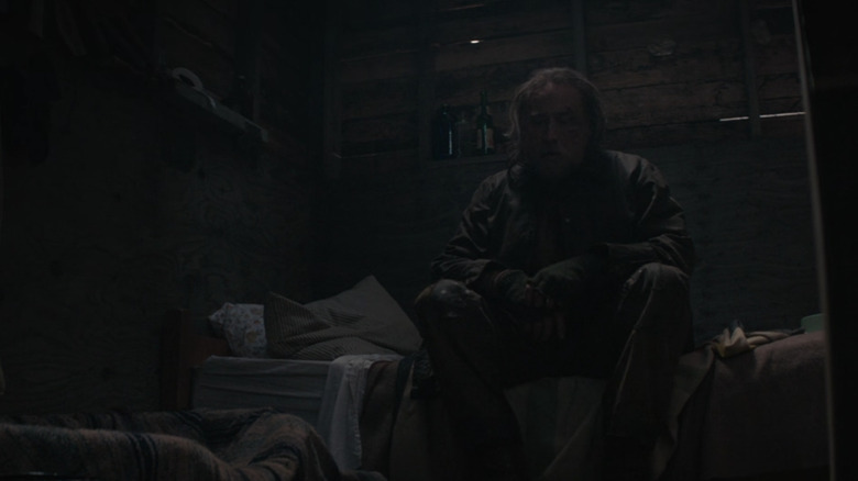 Nicholas Cage listening to tape in Pig