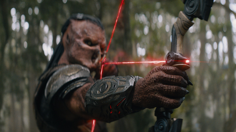 Dek using a laser bow and arrow in Predator: Badlands