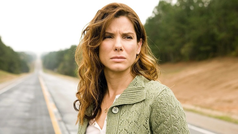 Linda Hanson standing in the middle of a road in Premonition