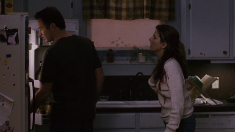 Linda Hanson speaking to Jim while he opens the fridge in Premonition
