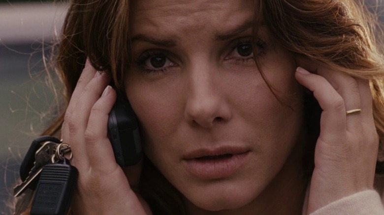 Linda Hanson talking on her cell phone and staring intently in Premonition