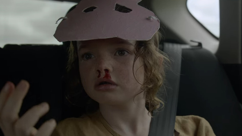 Mia in car with nosebleed
