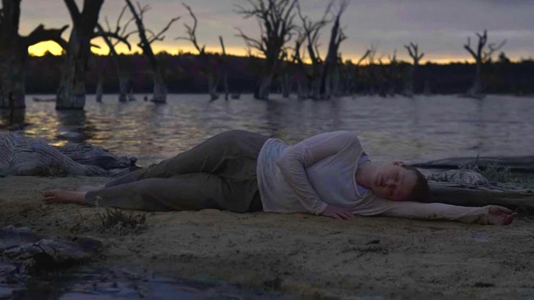 Sarah lying on the shore